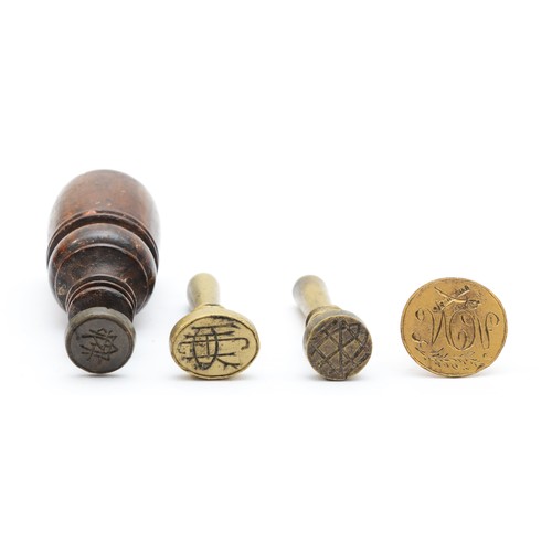 246 - Three brass hand seals and a mahogany hand seal