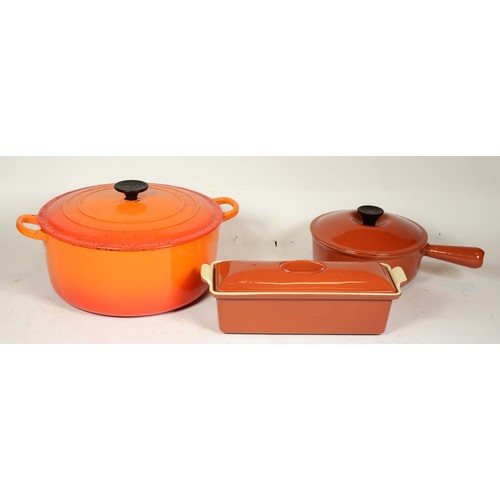 248 - Three pieces of  Le Creuset cast iron cooking pans to include a large casserole pot, saucepan and a ... 