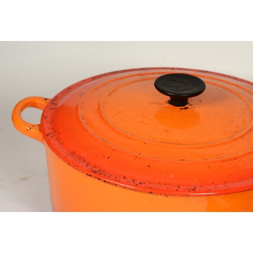 248 - Three pieces of  Le Creuset cast iron cooking pans to include a large casserole pot, saucepan and a ... 