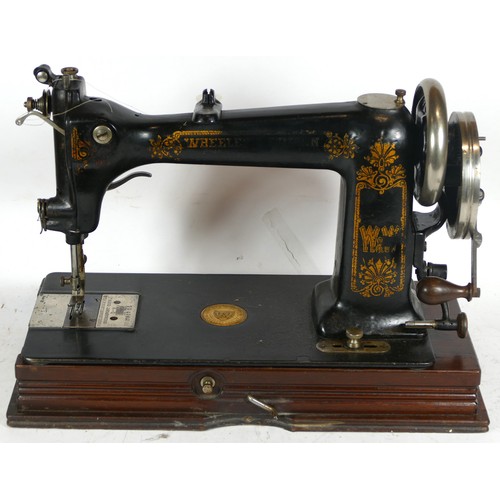 249 - A 20th century cased Singer sewing machine, together with another cased sewing machine.