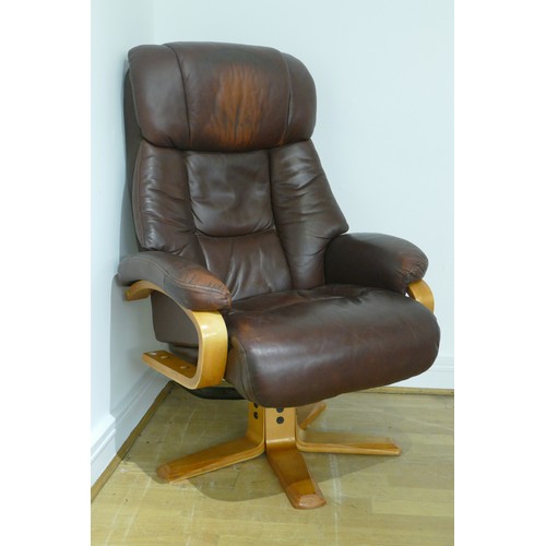 361 - A brown leather reclining swivel arm chair with matching foot stool.