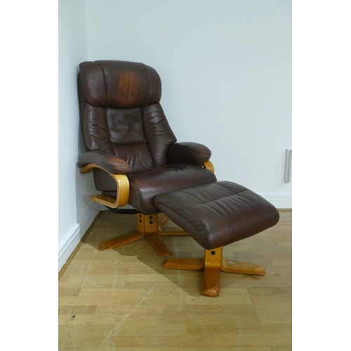 361 - A brown leather reclining swivel arm chair with matching foot stool.