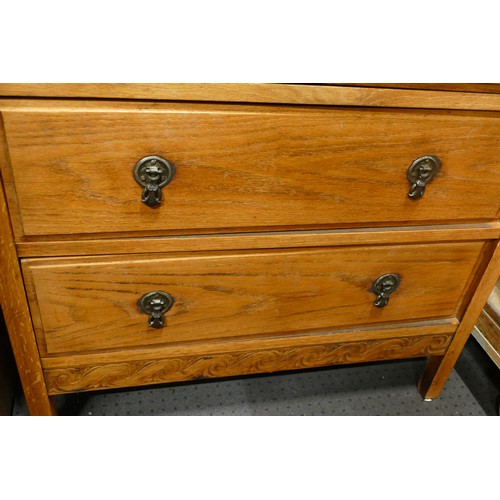 362 - A 1930s oak chest of two short over three long drawers, raised on tapering supports, 76cm wide, toge... 