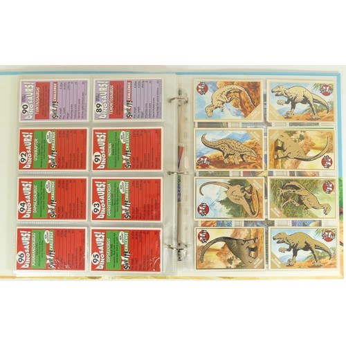 241 - A collection of 106 Dinosaurs 'Swop It' sticker cards by Orbis, together with 17 Topps sticker cards... 