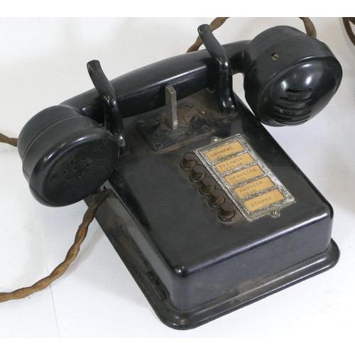 245 - Early 20th century bakelite telephones, tabletop and wall mounted examples.