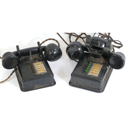 245 - Early 20th century bakelite telephones, tabletop and wall mounted examples.