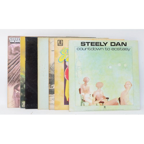 255 - A collection of 7 Steely Dan vinyl LPs, to include albums such as Pretzel Logic, Gaucho and Katy Lie... 