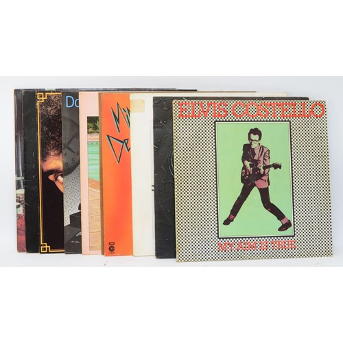 257 - A collection of ten vinyl LPs to include artists such as Elvis Costello, Little Feat & Philip Lynott... 