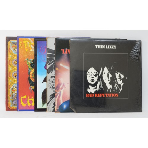 260 - A collection of six Thin Lizzy vinyl LPs to include albums such as Black Rose, Chinatown, and Live &... 