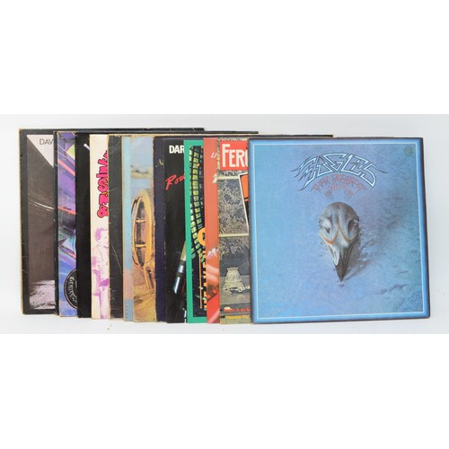 267 - A collection of fifteen vinyl LPs to include artists such as Eagles, Spirit & David Gilmour (15)