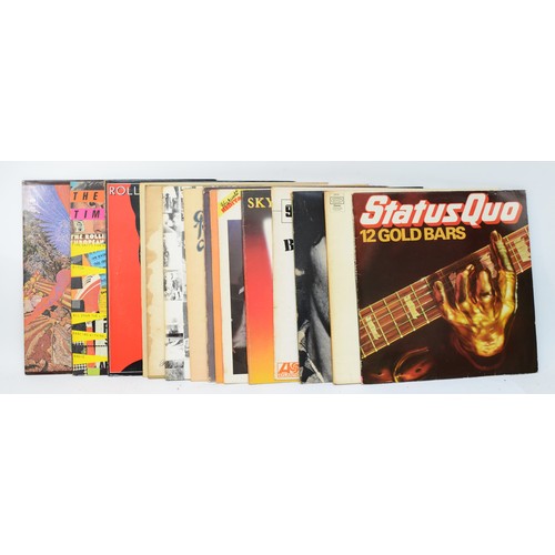 271 - A collection of fifteen vinyl LPs to include artists such as Status Quo, The Rolling Stones & Bruce ... 