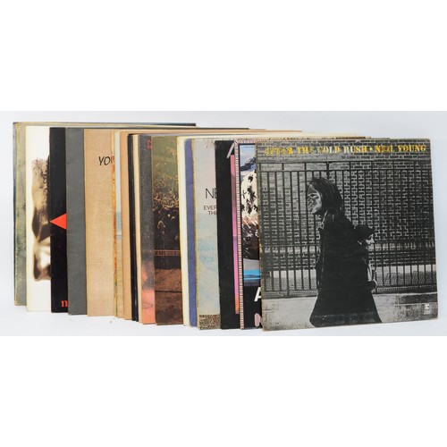 274 - A collection of twenty two  Neil Young vinyl LPs to include albums such as Trans, Freedom & On The B... 