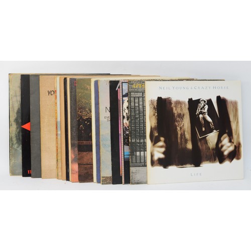 274 - A collection of twenty two  Neil Young vinyl LPs to include albums such as Trans, Freedom & On The B... 