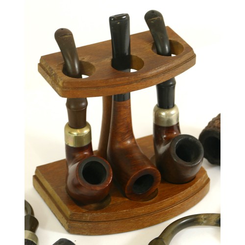 345 - Seven Irish Peterson pipes and a three pipe stand