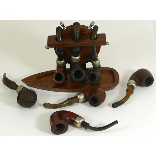 347 - Seven Irish Peterson pipes and a nautical three pipe stand