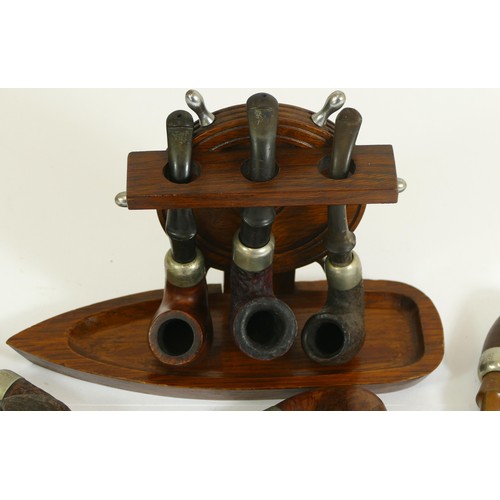 347 - Seven Irish Peterson pipes and a nautical three pipe stand