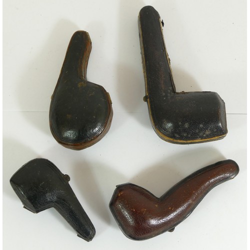 353 - Three carved Meerschaum pipes, and a plain example, all cased