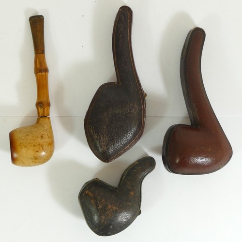 356 - A carved Meerschaum pipe of a mountain goat, another of a claw and two plain examples