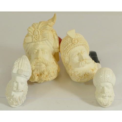 358 - A Turkish carved Meerschaum pipe of a nobleman, dated 1989, cased and three similar smaller examples