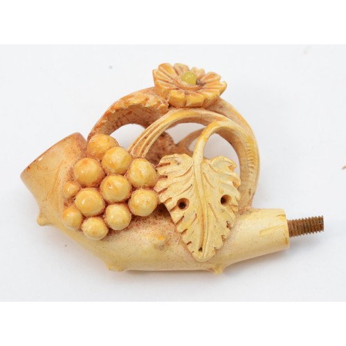 360 - A carved Meerschaum pipe in the form of a bunch of grapes, lacking mouthpiece, case and another depi... 