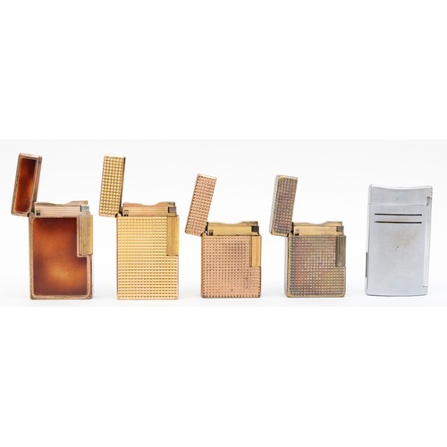 371 - S.T. Dupont, a gold plated brown lacquer and gold plated Rollagas lighter, three gold plated example... 