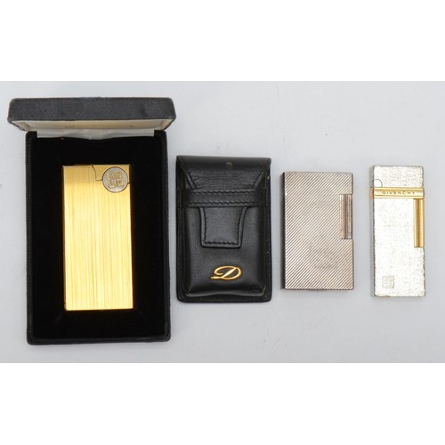 374 - S.T. Dupont, a silver plated Rollagas lighter, leather slip, Givenchy, a silver and gold plated gas ... 