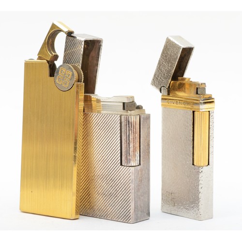 374 - S.T. Dupont, a silver plated Rollagas lighter, leather slip, Givenchy, a silver and gold plated gas ... 