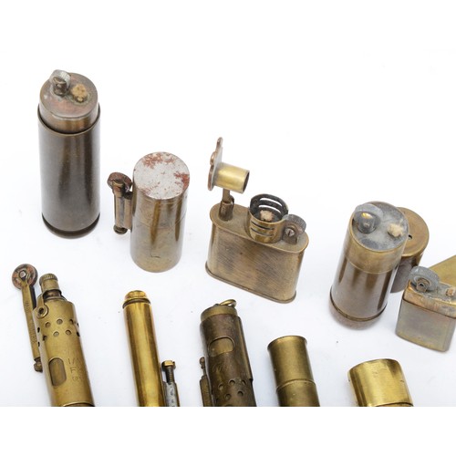 380 - Twelve various brass Trench Art and other petrol lighters