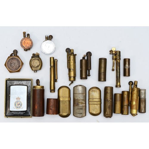 381 - A 1939 one penny Trench Art petrol lighter, three other similar, a Zippo 43rd Fighter Squadron RAF l... 