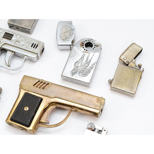 383 - Three novelty pistol lighters, a British Zone, Germany lighter and five other lighters