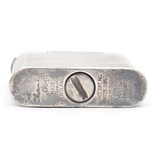 384 - A silver-plated 'The Charles' petrol pocket lighter, c. 1950, stamped 'The Charles Lighter', MADE IN... 