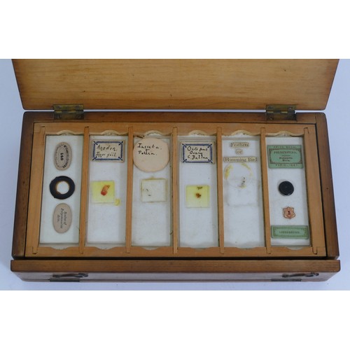 419 - A 19th century collection of microscope slides, six trays, labels to include Prize Medal Paris 1867 ... 