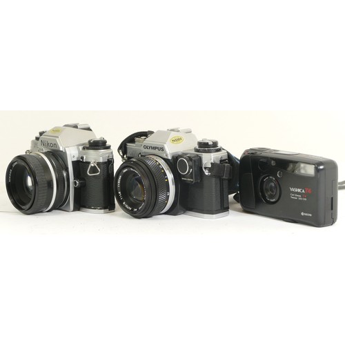 427 - Three cameras comprising of a Nikon FG-20 with a 1:1.8 50mm lens, an Olympus OM10 with an Olympus OM... 