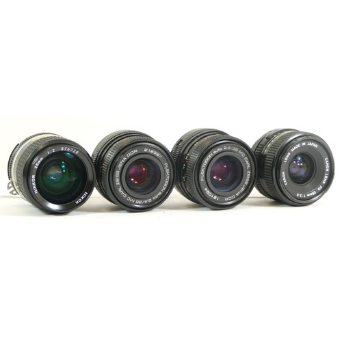 430 - Four assorted camera lens comprising of a Canon FD 28mm 1:2.8 lens , two Carl Zeiss Flektogan 2.4/35... 