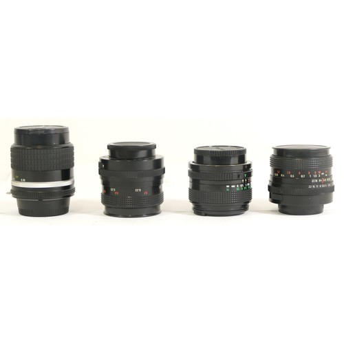 430 - Four assorted camera lens comprising of a Canon FD 28mm 1:2.8 lens , two Carl Zeiss Flektogan 2.4/35... 