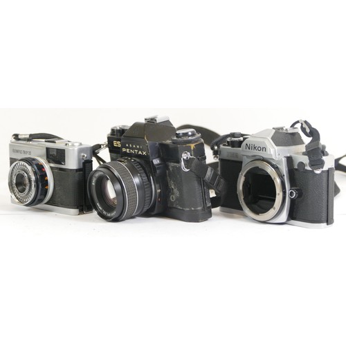 433 - Three cameras comprising of a Nikon FM2, Pentax Asahi ES camera and an Olympus Trip 35 camera with a... 