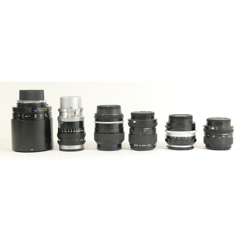 434 - Six assorted camera lenses comprising of a Canon FD 50mm 1:1.4, a Nikon Nikkor 1:2.5 105mm lens, a C... 