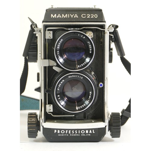 435 - A Mamiya C220 camera mounted with two Mamiya-Sekor f=80mm 1:2.8 lenses.