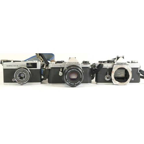 436 - Three assorted cameras comprising of a Olympus OM-2 body, Pentax ME Super with SMC Pentax-1:2 50mm l... 