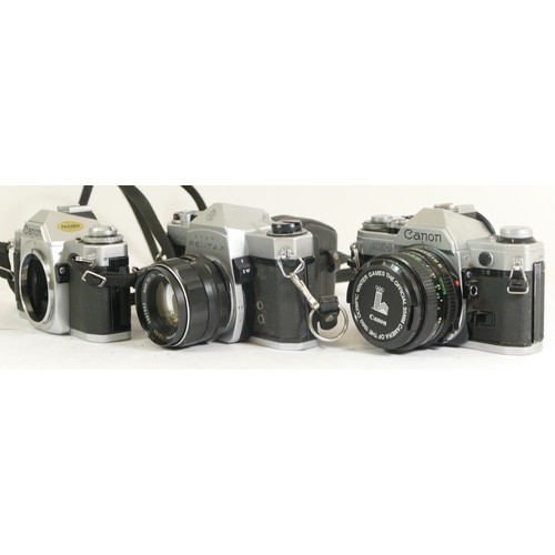 440 - Three assorted cameras comprising boxed Canon AV-1 camera body, Pentax Spotmatic camera with a Asahi... 