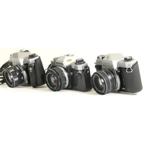 441 - Three assorted cameras comprising of an Olympus OM10 with IM-System Zuiko 50mm 1:1.8 lens complete w... 