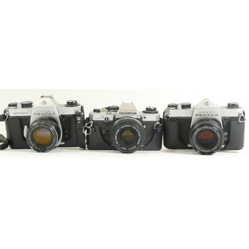 441 - Three assorted cameras comprising of an Olympus OM10 with IM-System Zuiko 50mm 1:1.8 lens complete w... 