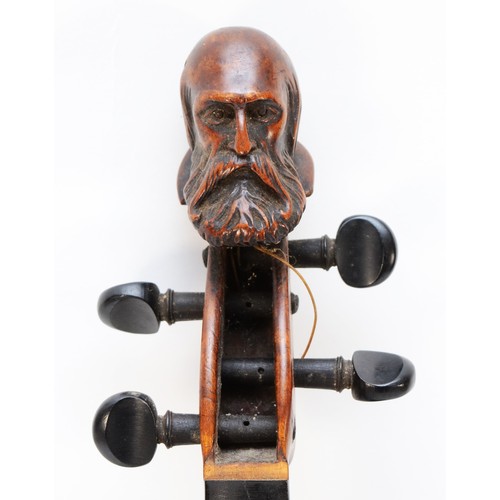 451 - A Victorian carved head violin, possibly by Jean-Baptiste Vuillaume, France, the carved head depicti... 