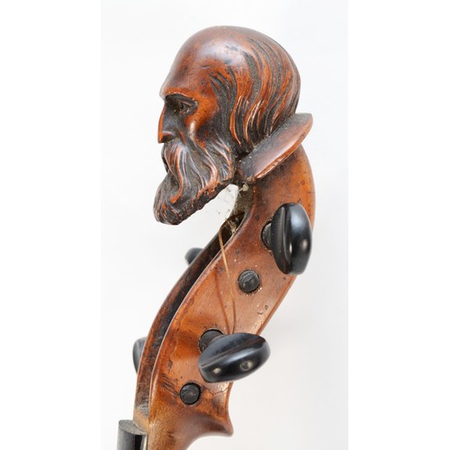 451 - A Victorian carved head violin, possibly by Jean-Baptiste Vuillaume, France, the carved head depicti... 