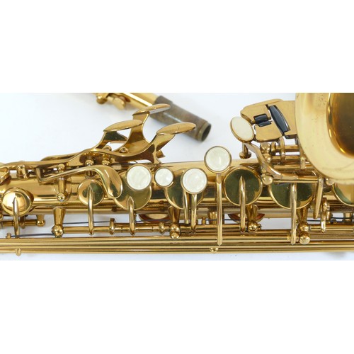 452 - A contemporary Premier alto brass saxophone, impressed 0919710, with engraved floral and leaf decora... 