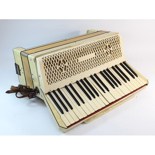 459 - A 20th century cased 120 button piano accordion, 41cm wide