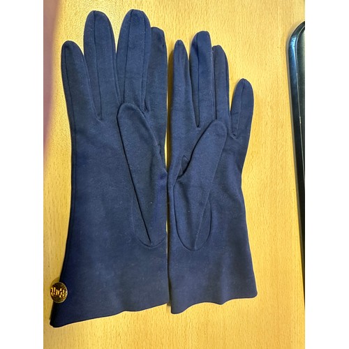 470 - Cornelia James navy blue gloves, size 7½, Made in England, features a gold button stamped E II R.
Th... 