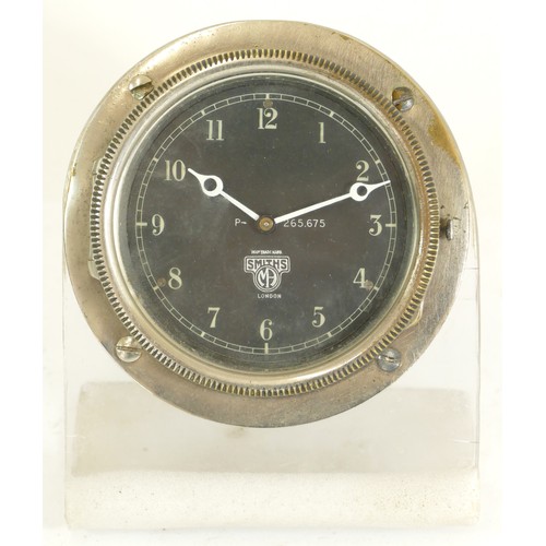 477 - A Smiths of London chrome plated car clock, c.1930's, the black dial with Arabic numerals, housed in... 