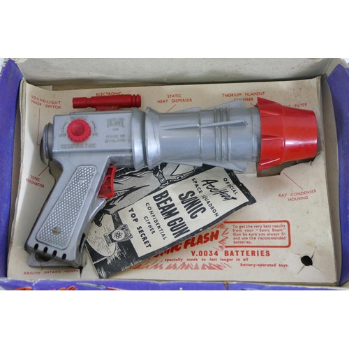 220 - A boxed Space Squadron Sonic Beam Gun, together with a boxed Lone Star 9mm Luger Presentation set (2... 