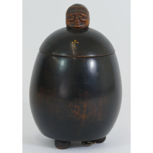 402 - A musical wooden tobacco box in the form of a friar, 18cm